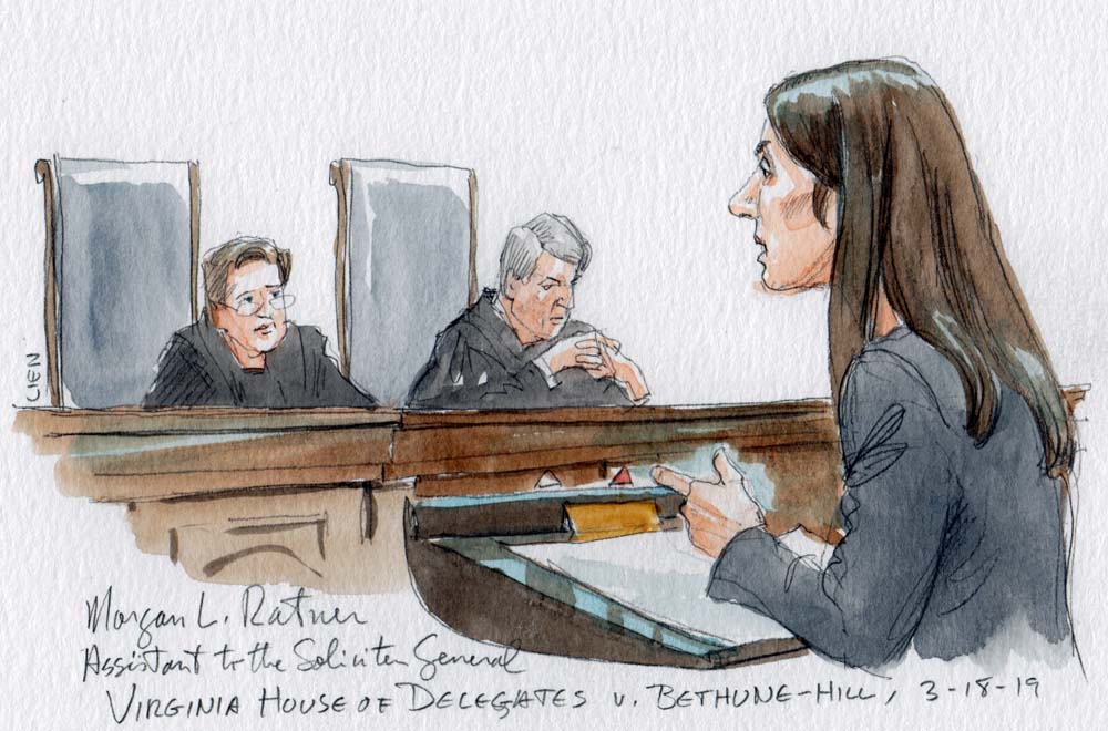 Woman speaking before two justices on the bench