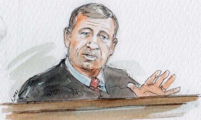 sketch of john roberts sitting behind bench with palm extended