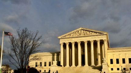 front facade of Supreme Court illuminated in winter sun