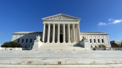 front facade of Supreme Court against blue sky