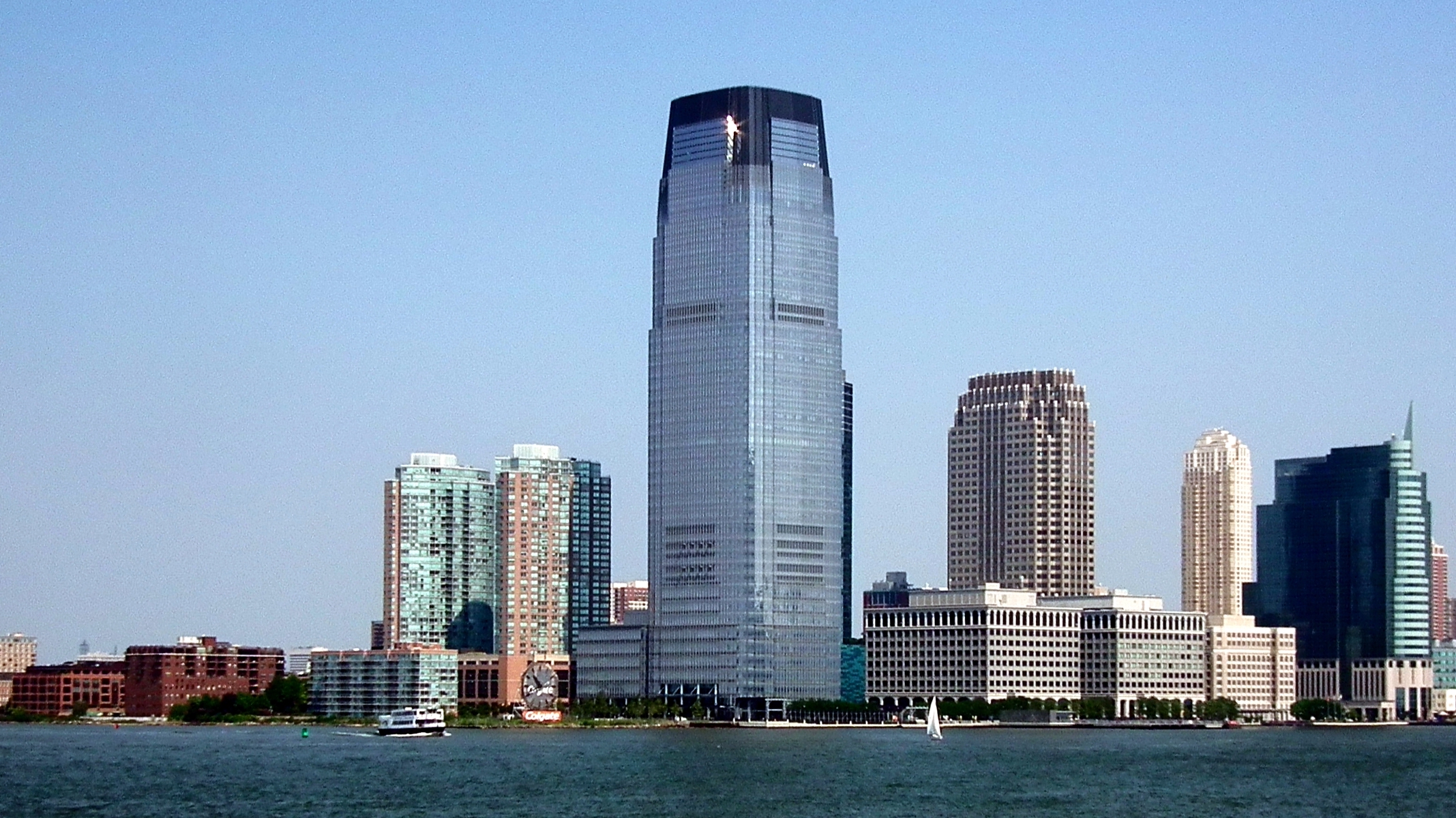 large skyscraper along riverbank