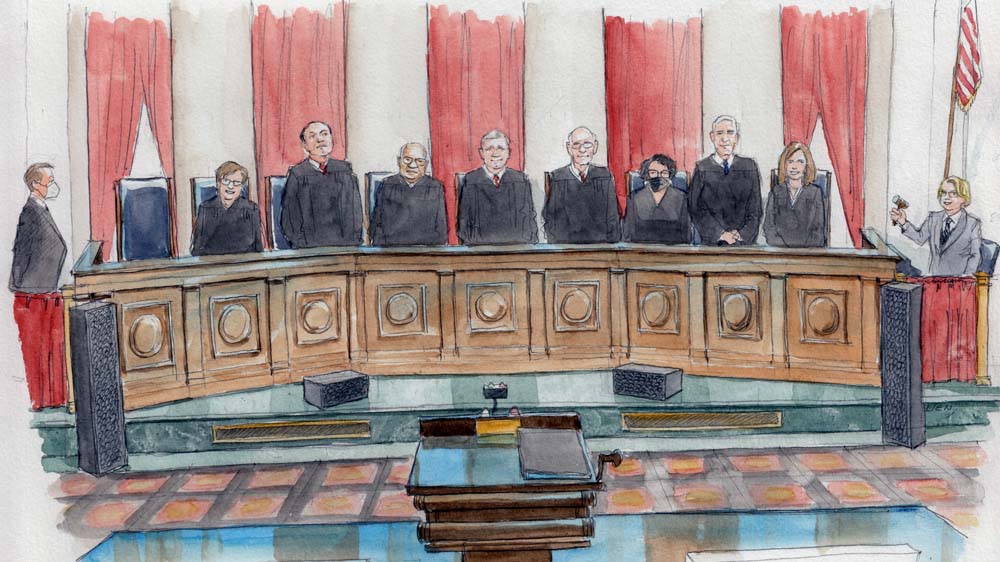 eight justices stand at the bench, only Sotomayor is masked.