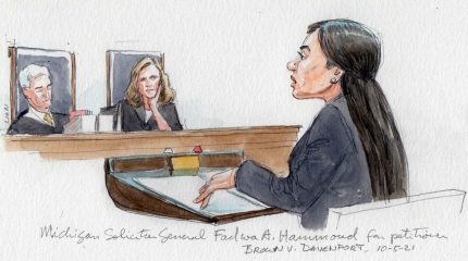 justices Gorsuch and Barrett watch as Michigan solicitor general Fadwa Hammoud speaks for the petitioner in the courtroom