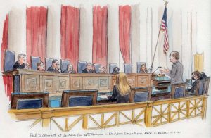 Eight justices on the bench with three people facing 