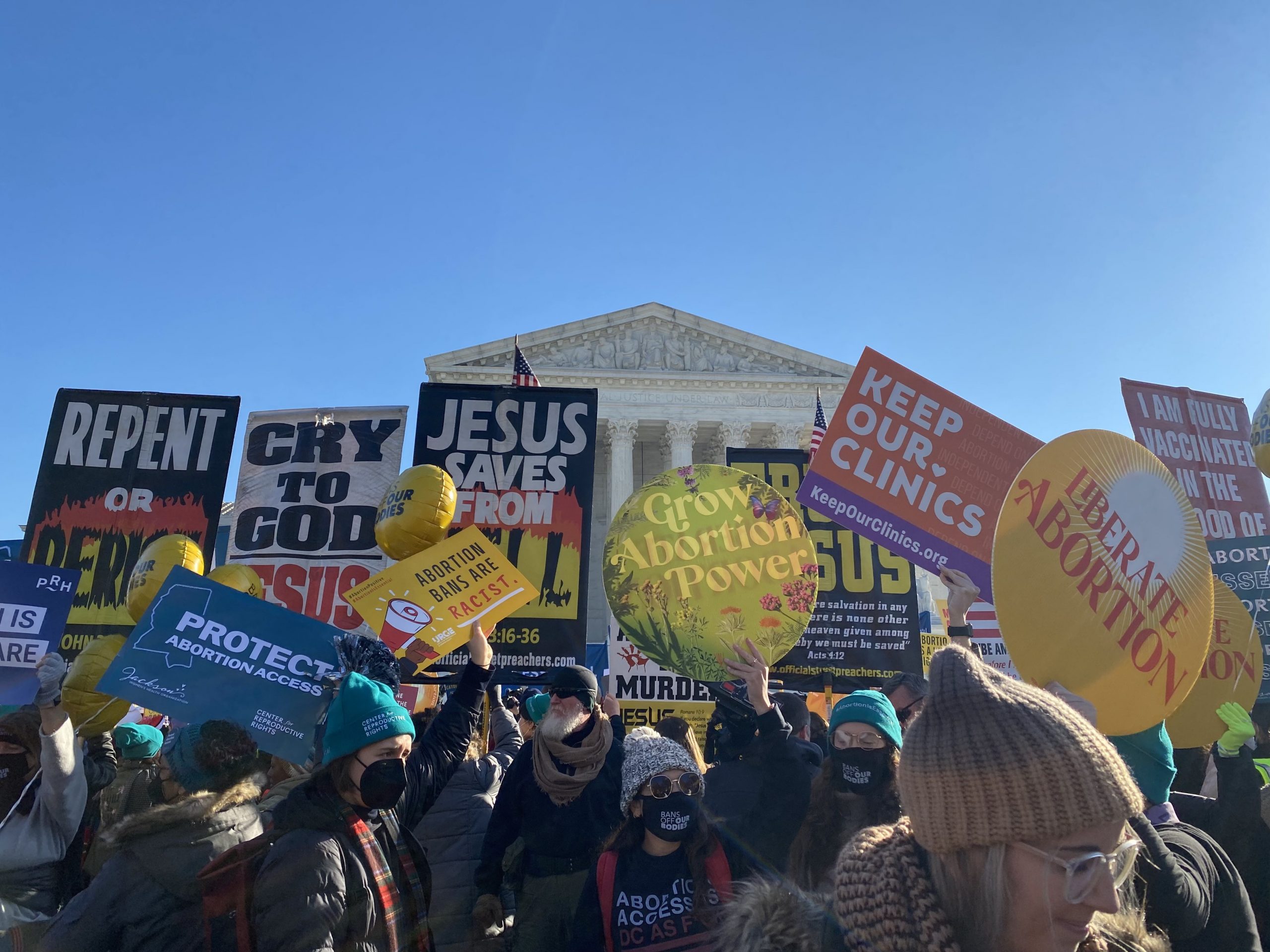Protest signs in front of the Supreme Court