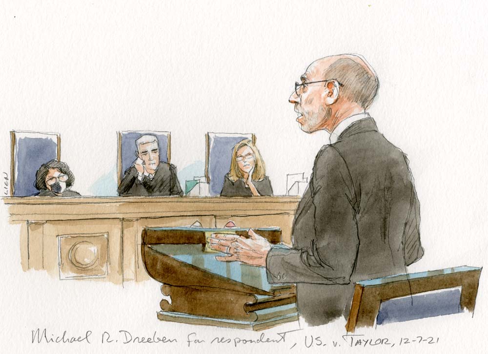 balding man with glasses arguing in front of three justices, some less amused than others