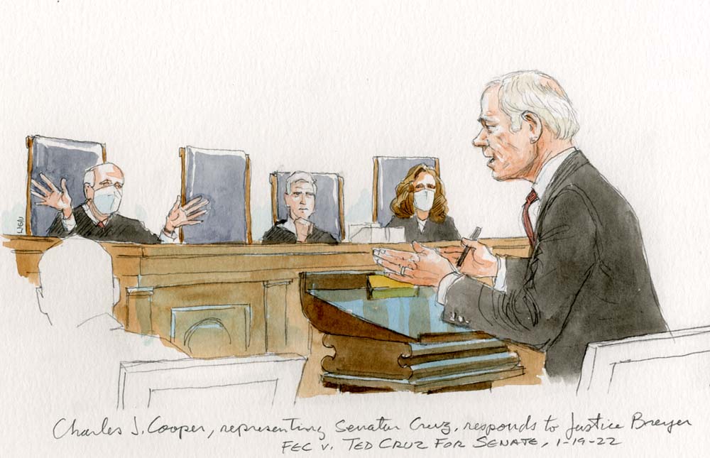 Man at podium talks to Justice Breyer who speaks with his hands