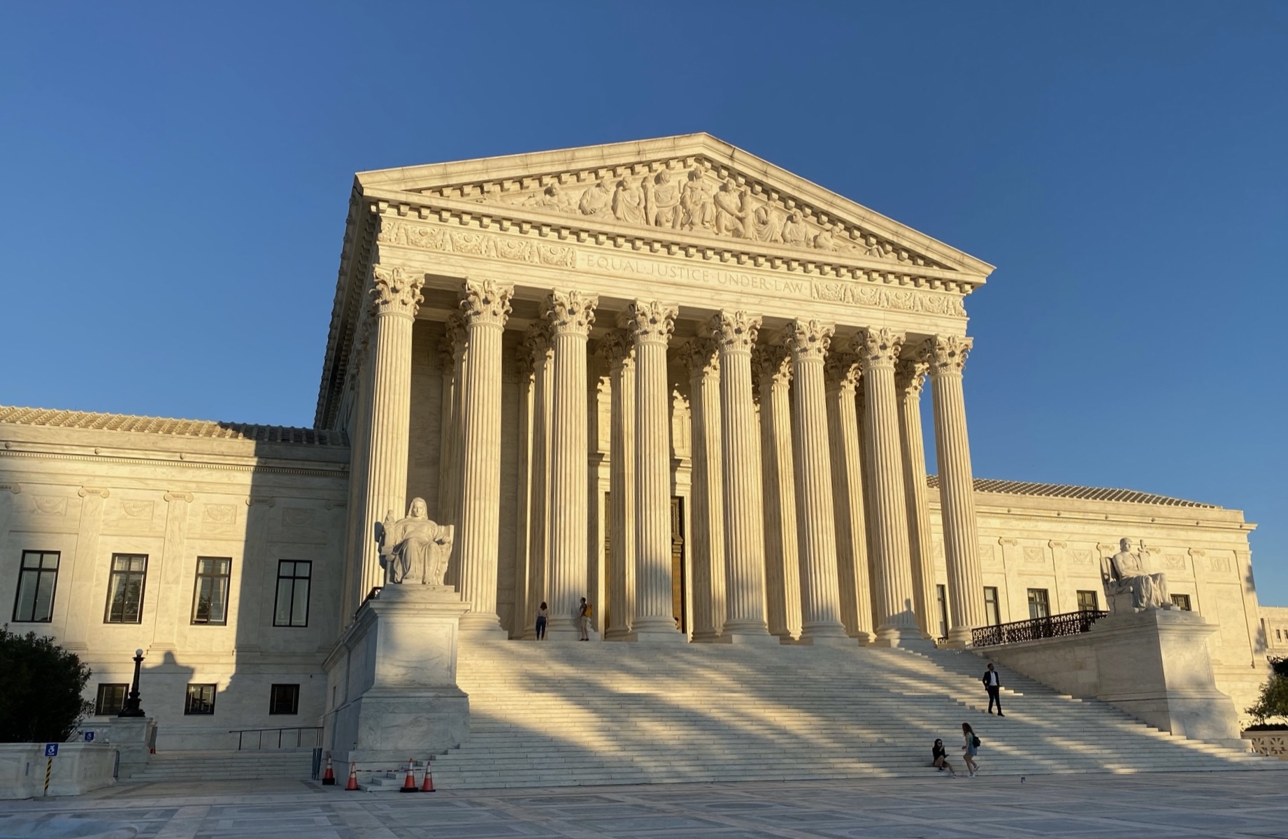 front view of supreme court building with plaza engulfed in shadows