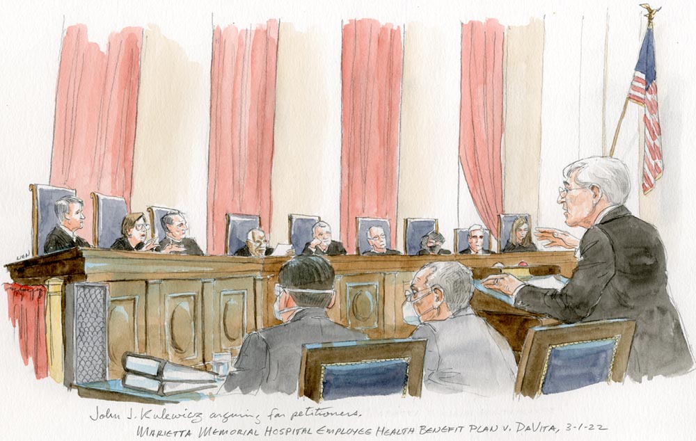 man in glasses argues before the full bench. Justice Kagan gestures while speaking. Justice Thomas considers a document intently.