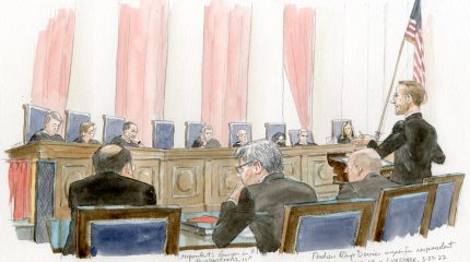 Man argues before eight justices on the bench and Justice Thomas' empty chair.