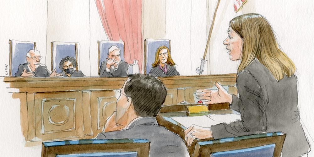 Woman speaking to four justices on the bench