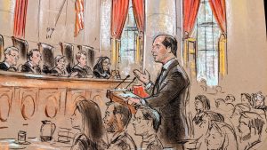 sketch of man gesturing with his right hand before the lectern, speaking before five pictured justices