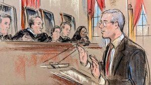 Sketch of man with glasses arguing at the podium. Five justices are visible in frame.