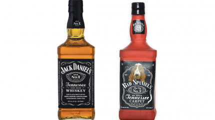 side by side comparison of jack daniel's whiskey bottle and similar-looking "Bad Spaniels" dog toy