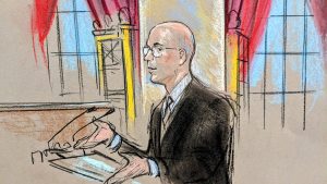 Sketch of a man in spectacles arguing at the podium.