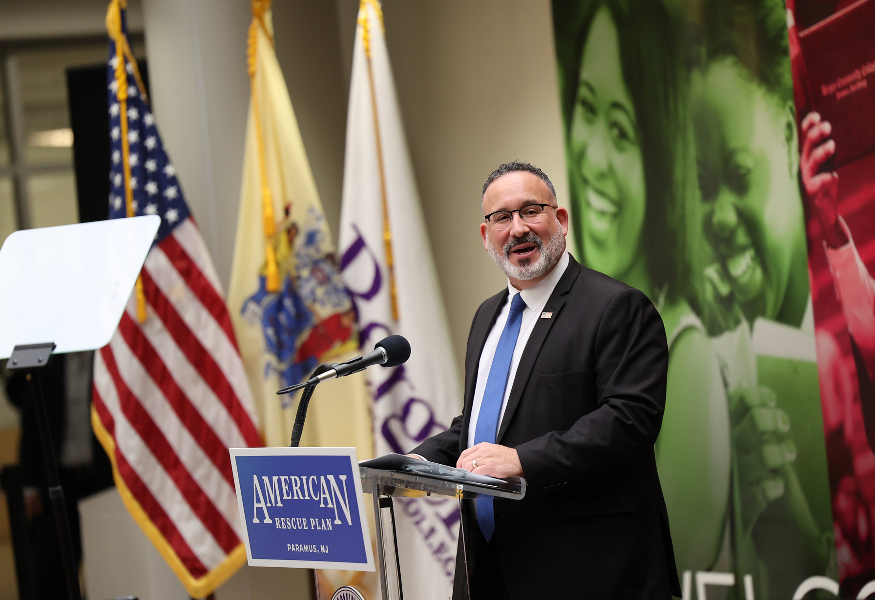 Man speaking at lectern