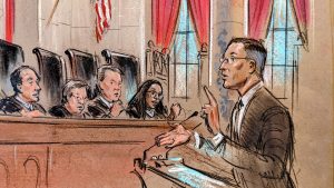 Sketch of a man in spectacles pointing up with his left index finger as he responds to the justices.
