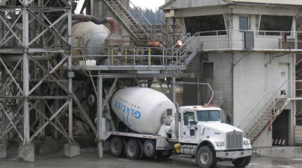 A cement mixer being filed at a cement plant.