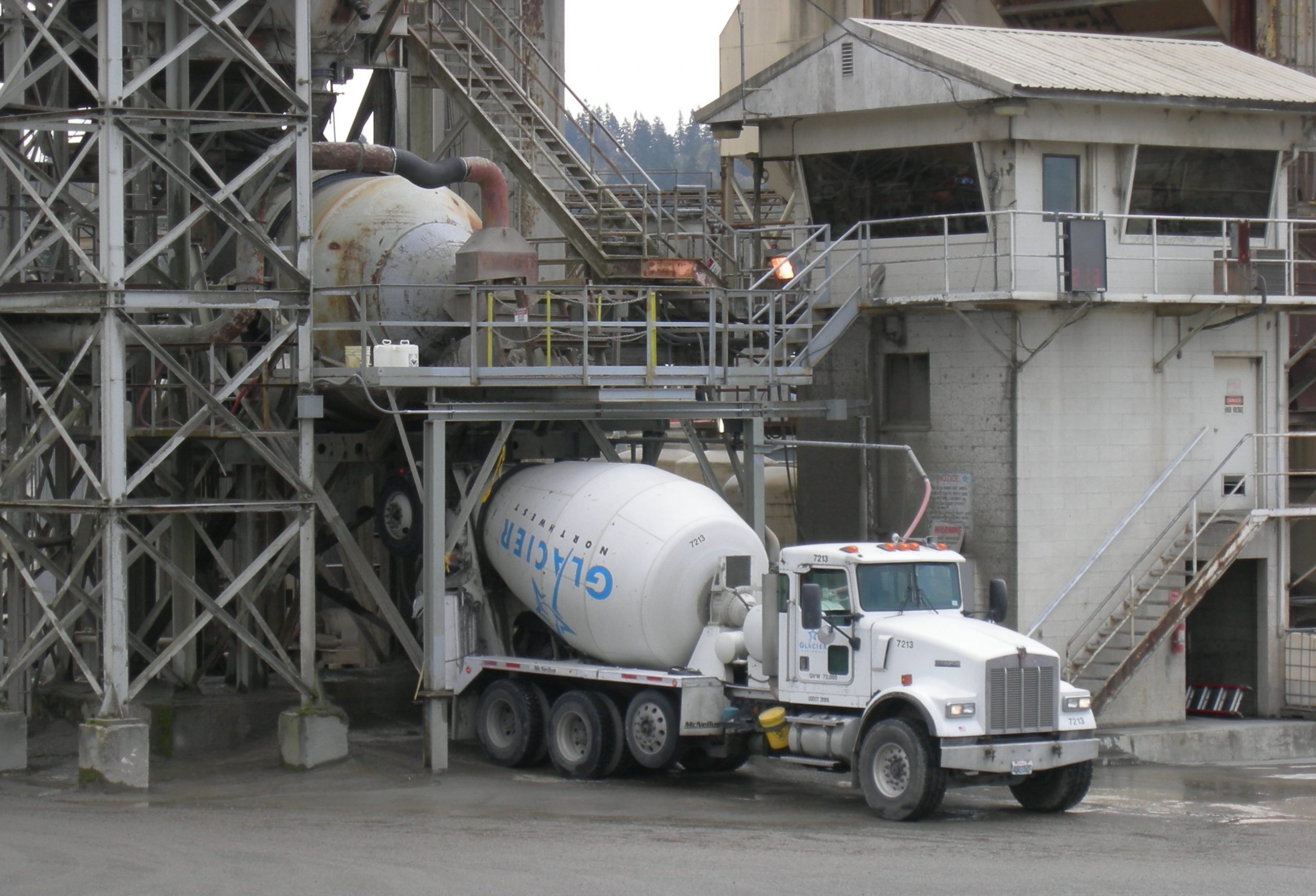 A cement mixer being filed at a cement plant.