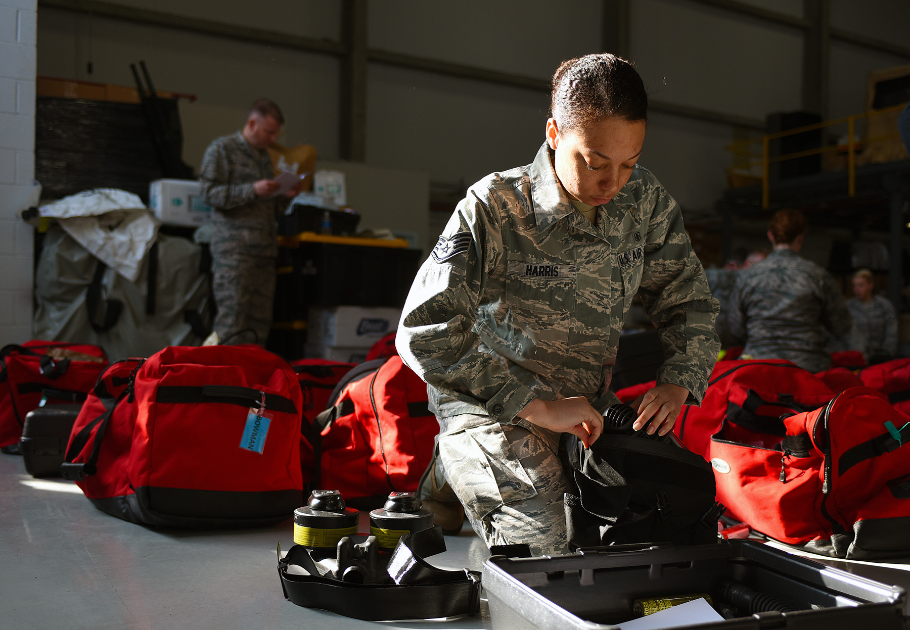 A biomedical equipment technician with the 121st Medical Group of the Ohio National Guard packs her gear for a training event.