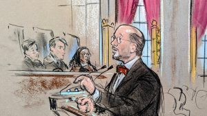 Sketch of man in spectacles in red bow tie arguing before the podium.