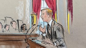 Sketch of man in dark suit leaning on the podium.