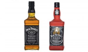 A bottle of Jack Daniel's whiskey next to a dog toy shaped to resemble the bottle