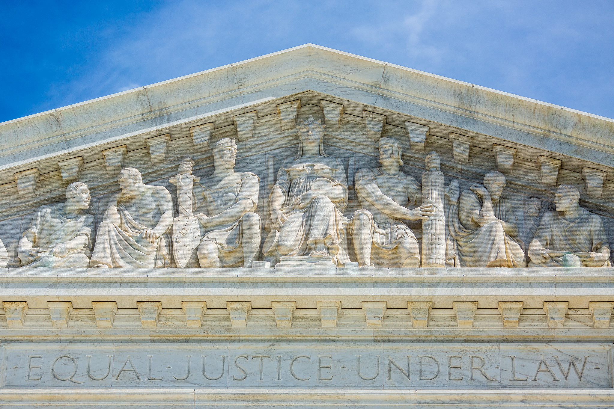 The busts on the front of the Supreme Court building