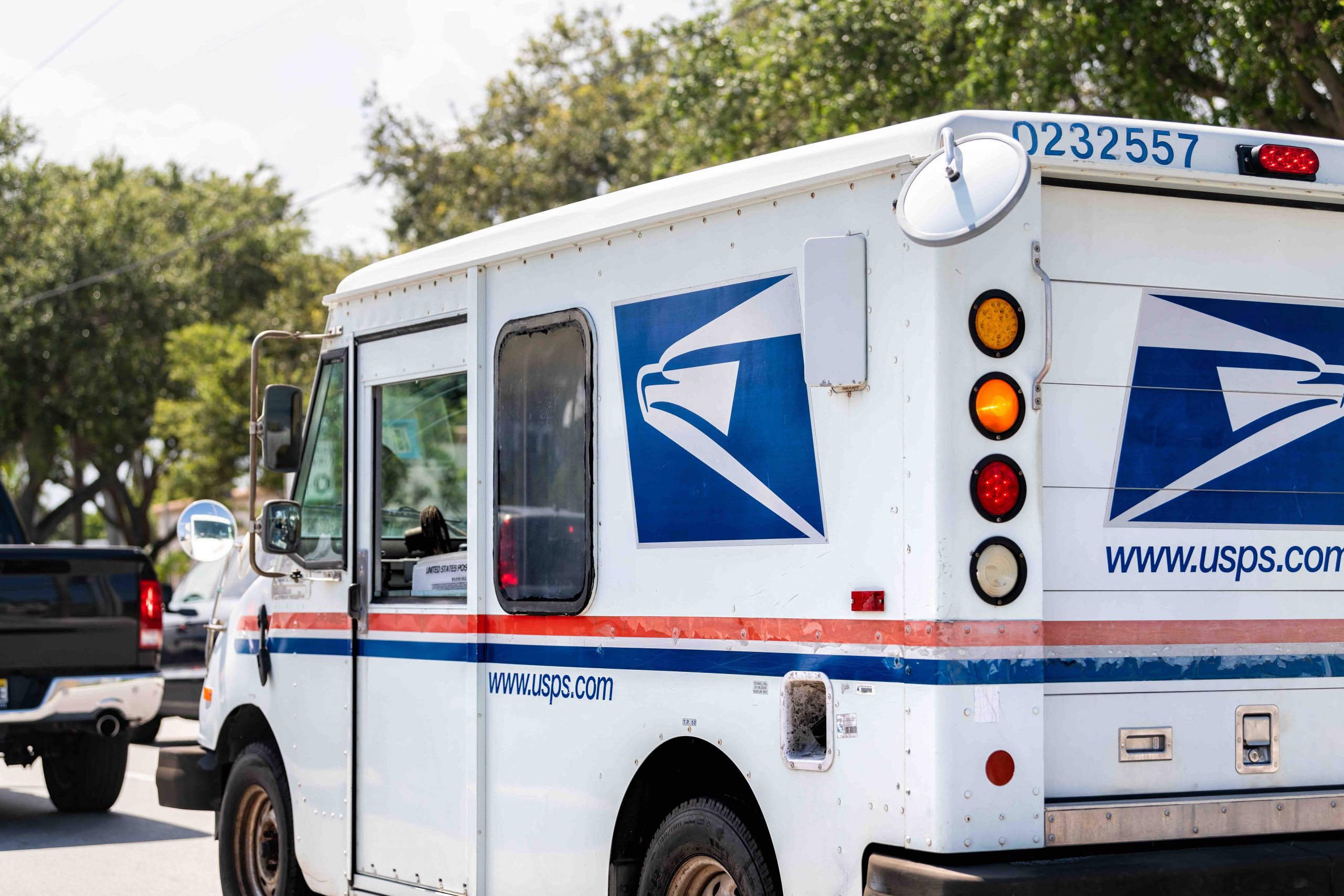 U.S. Postal Service van in traffic