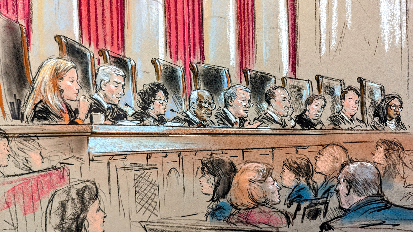 The justices on the bench with audience members listening in.