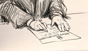 Justice's hands signing a paper. 
