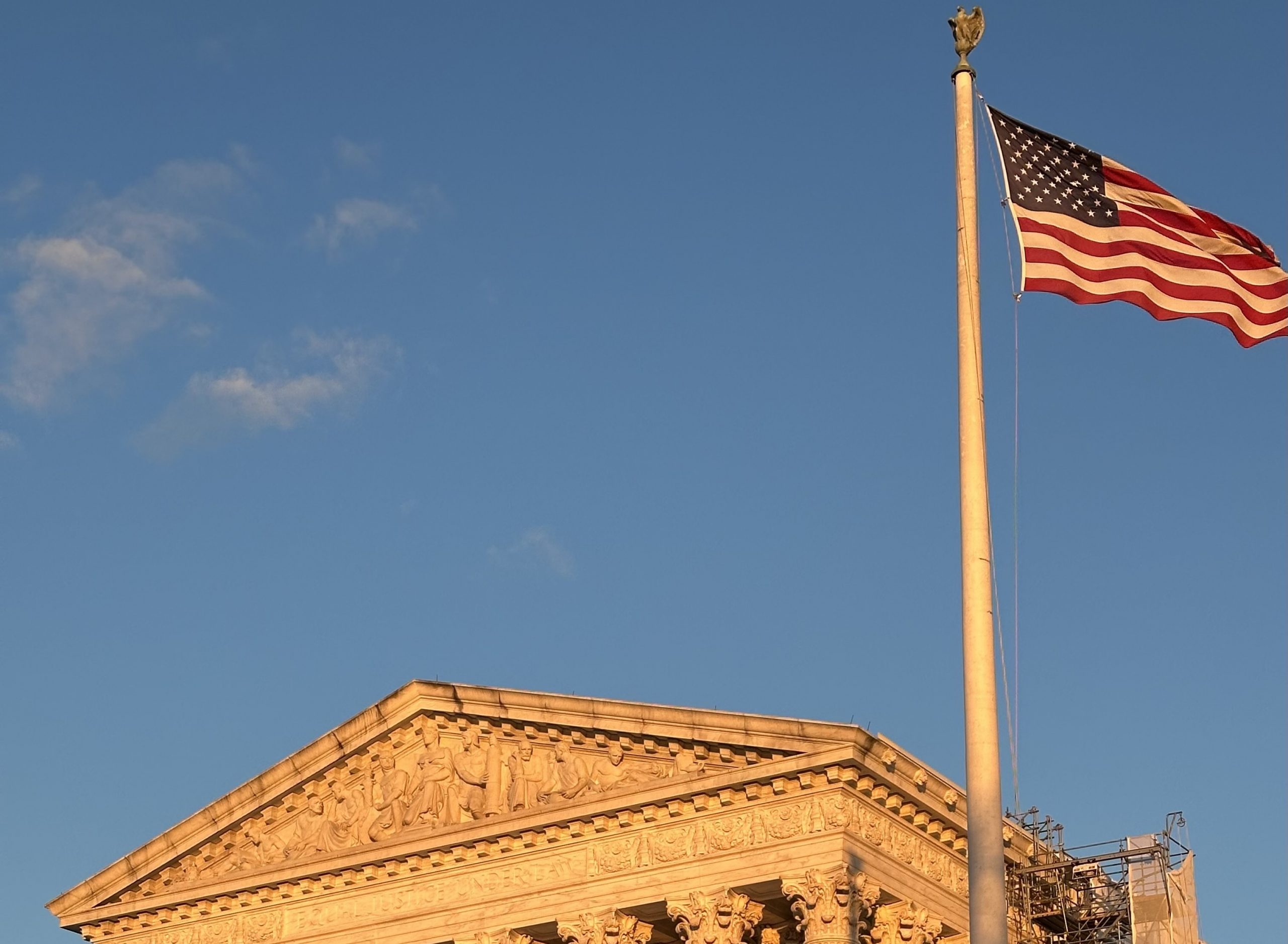 An American flag flies over the Supreme Court