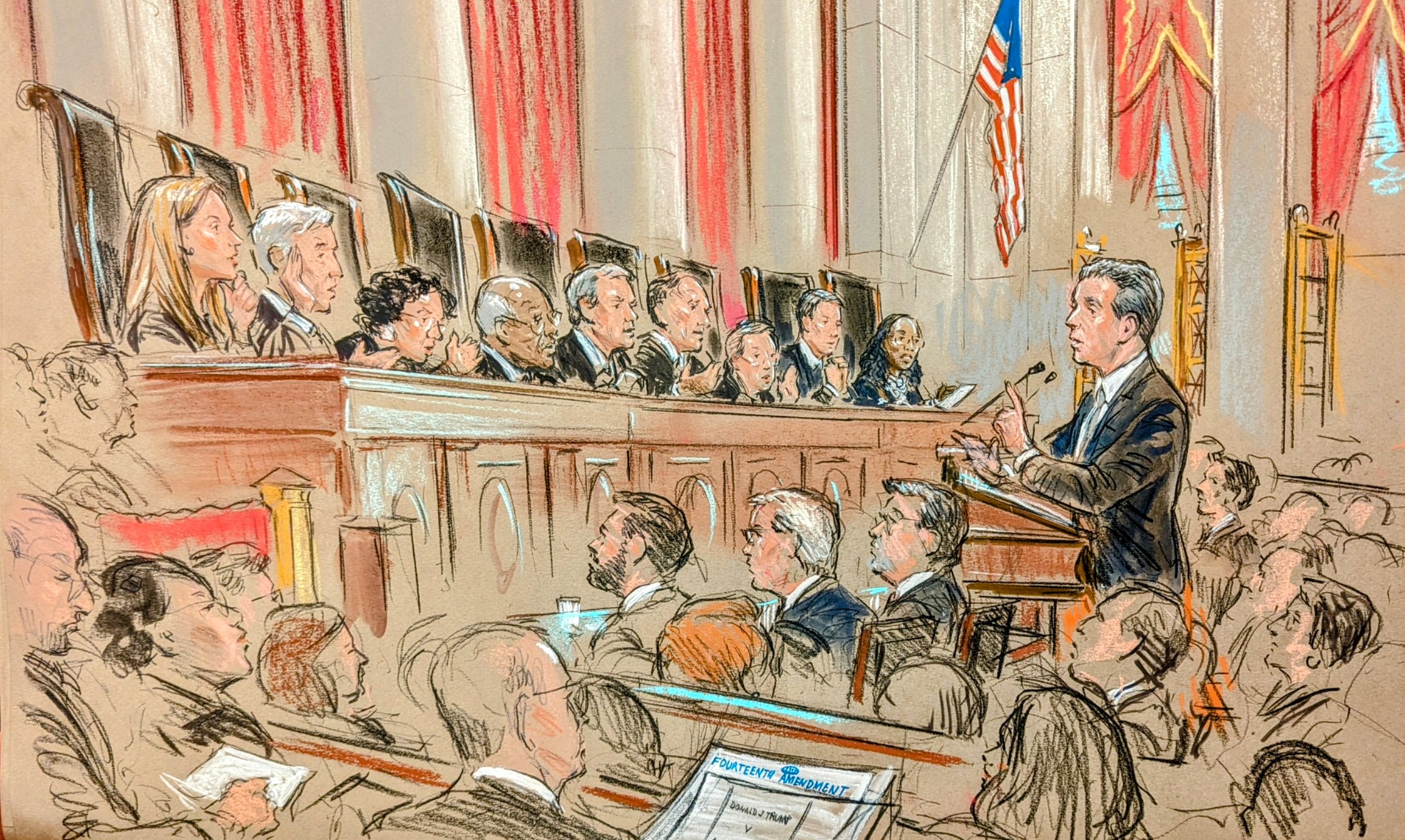 In a full courtroom, the audience looks on as a lawyer stands and discusses his case with all nine justices on the bench.
