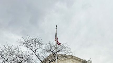 cloudy sky, flag, and supreme court