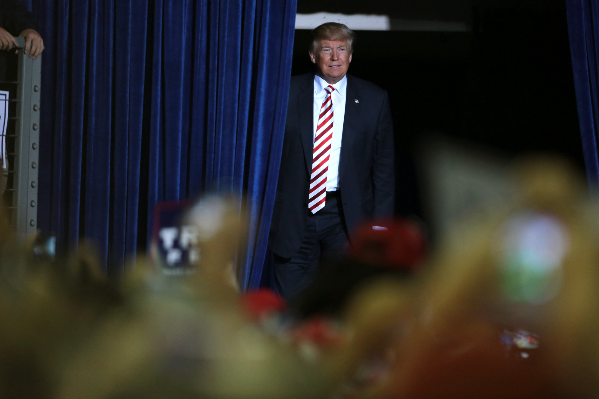 former President Donald Trump walking on stage