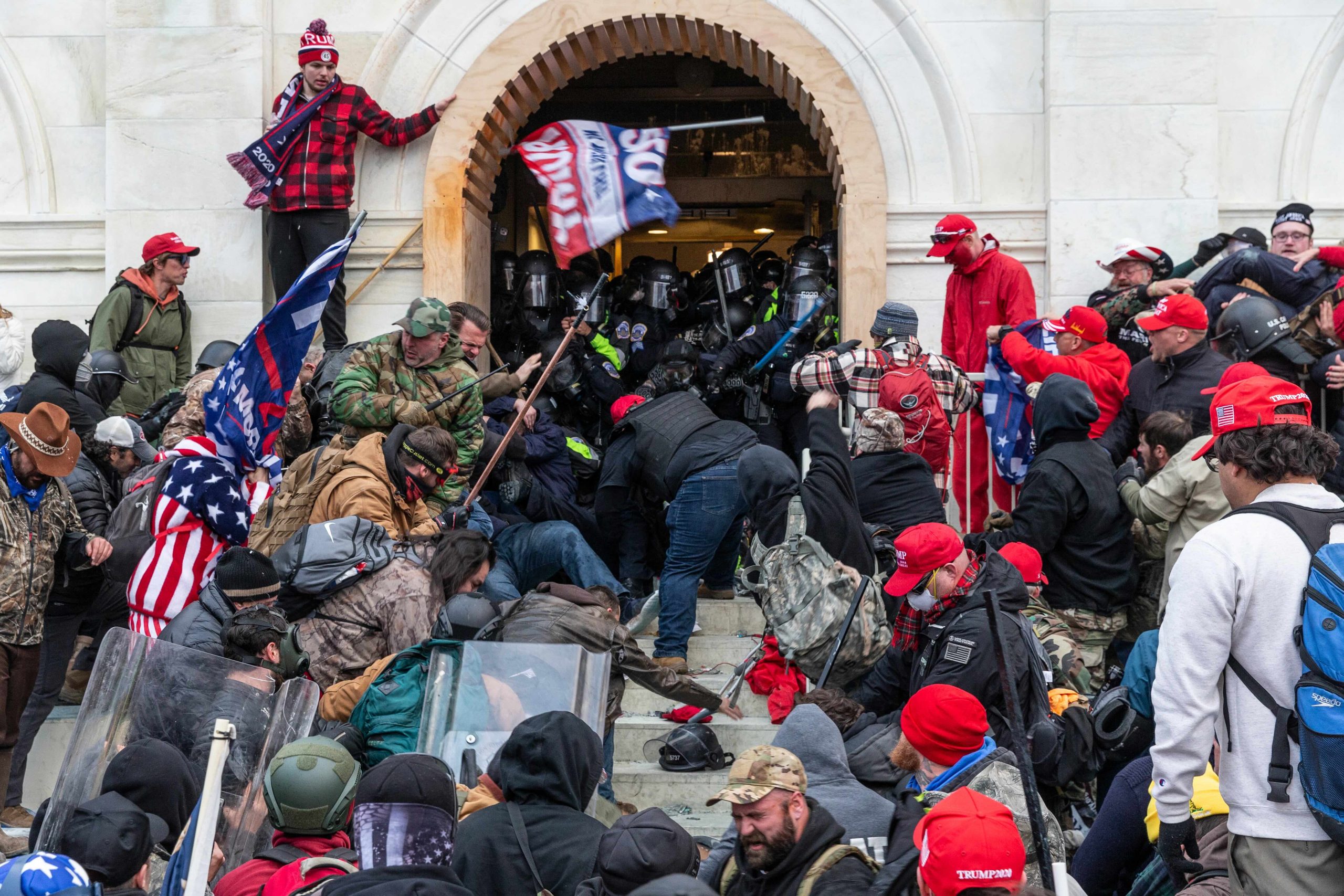 Rioters clash with police as they attempt to enter the U.S. Capitol by force.