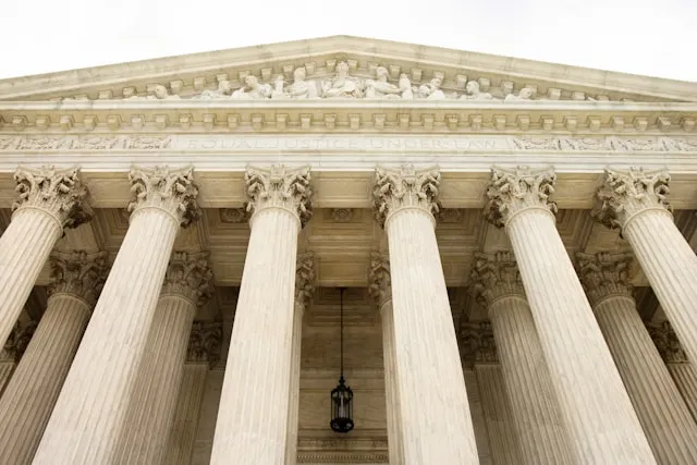 engravings at top of Supreme Court building are shown