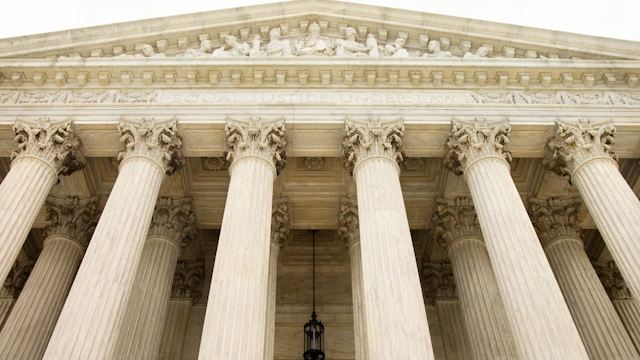 engravings at top of Supreme Court building are shown