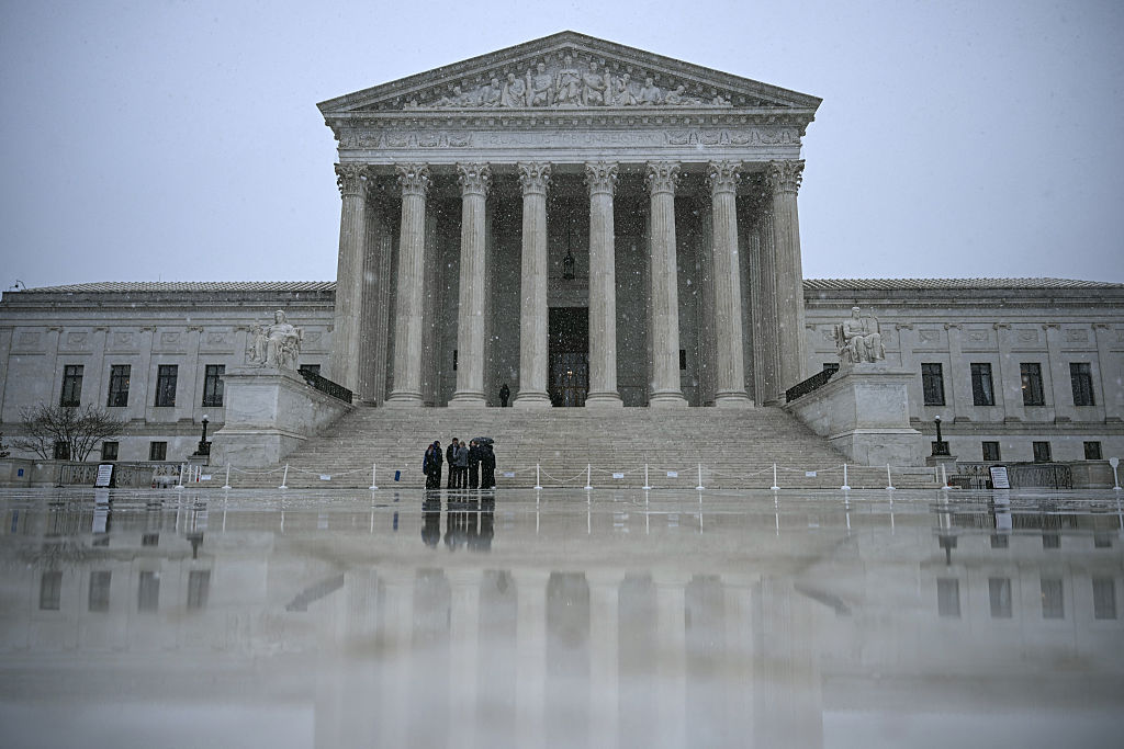 Snow flurries fall outisde the US Supreme Court in Washington, DC, on March 12, 2026.